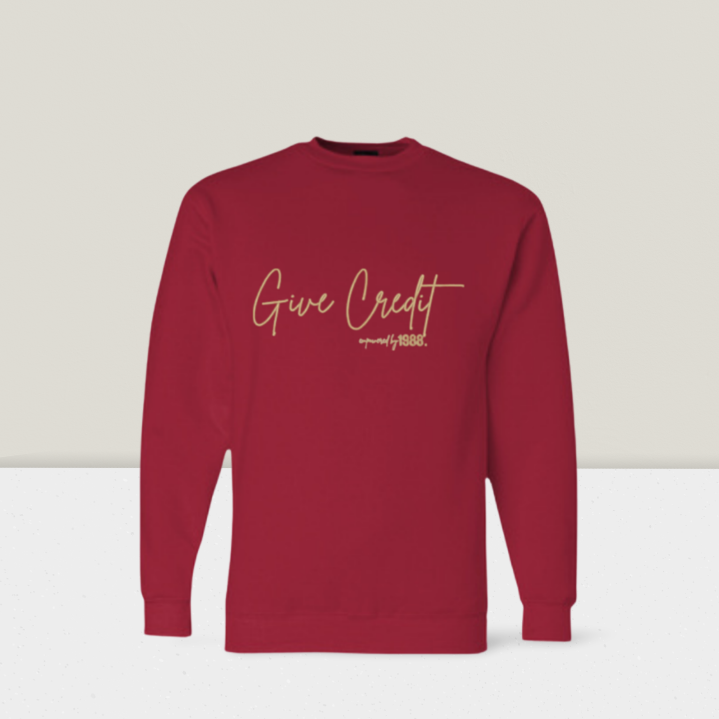 “GIVE CREDIT” SWEATSHIRT — CARDINAL RED
